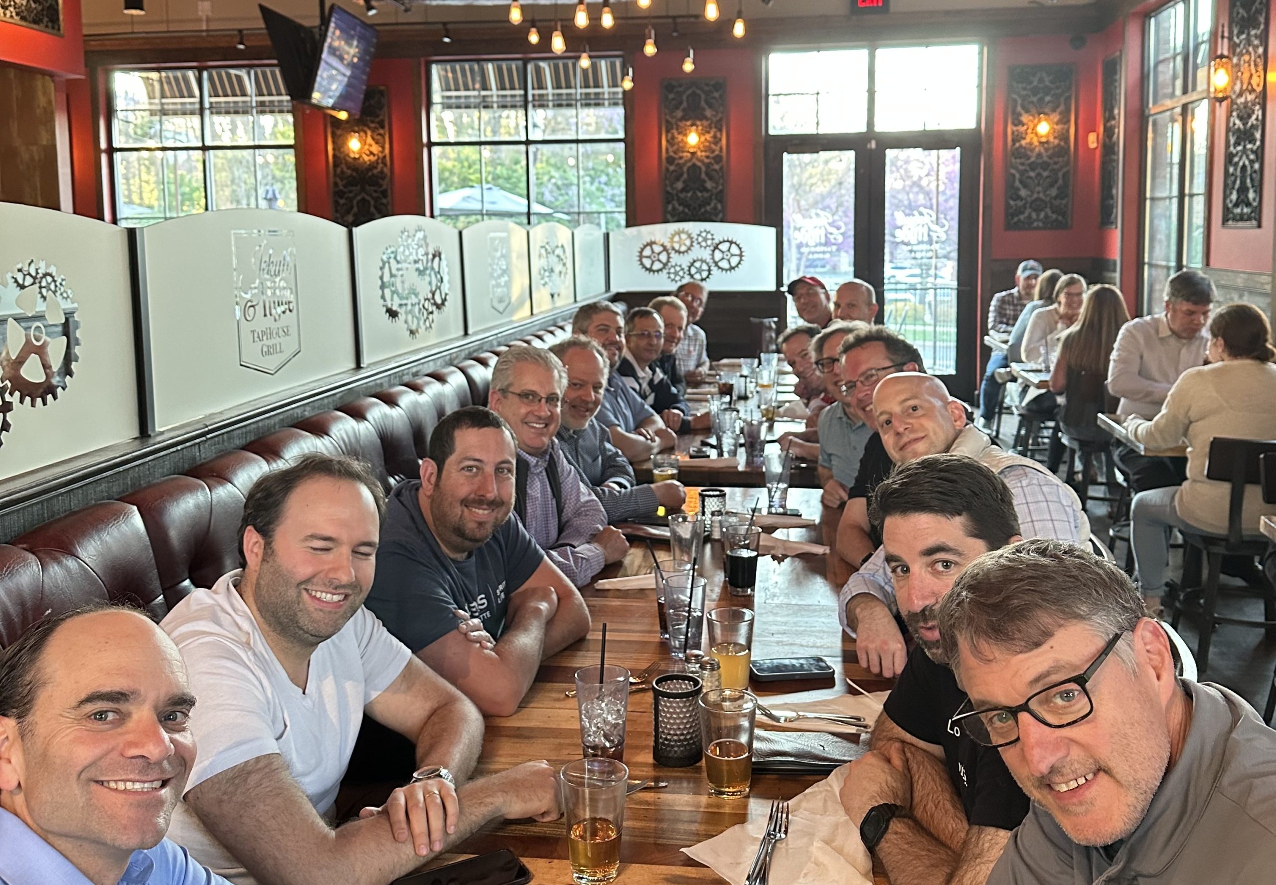 Men gathered around a dinner table — Charlotte, NC